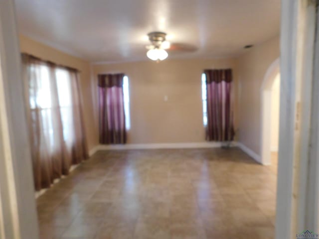 empty room featuring ceiling fan