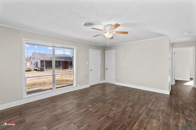 unfurnished room featuring a textured ceiling, dark hardwood / wood-style floors, ceiling fan, and ornamental molding