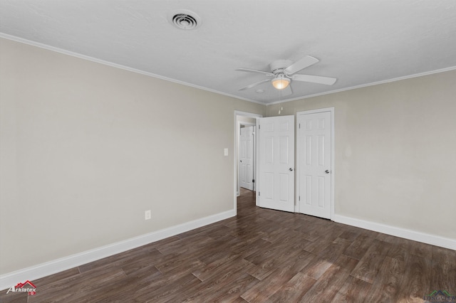 unfurnished bedroom with ceiling fan, ornamental molding, and dark wood-type flooring