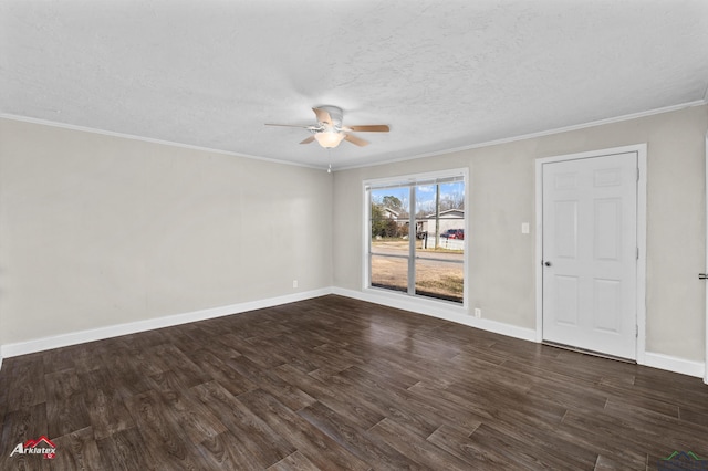 spare room featuring a textured ceiling, ceiling fan, ornamental molding, and dark wood-type flooring