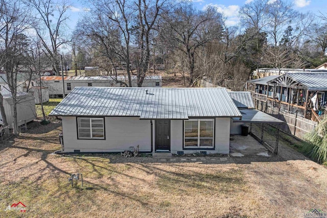 back of house with a yard and a carport