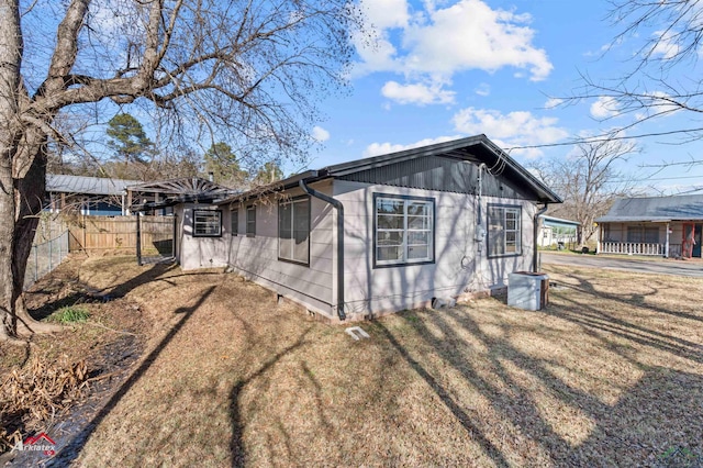 view of property exterior featuring a yard