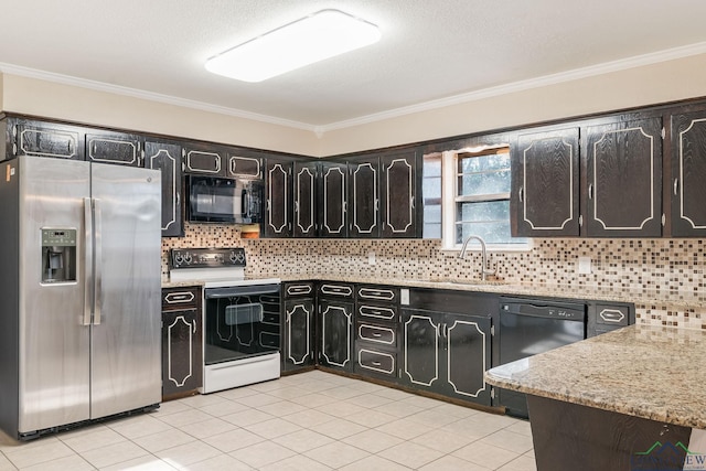 kitchen with sink, light tile patterned flooring, ornamental molding, light stone countertops, and black appliances