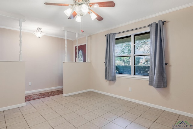 spare room featuring light tile patterned flooring, ornamental molding, and ceiling fan