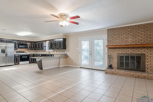 kitchen with range with electric stovetop, stainless steel fridge with ice dispenser, french doors, and crown molding