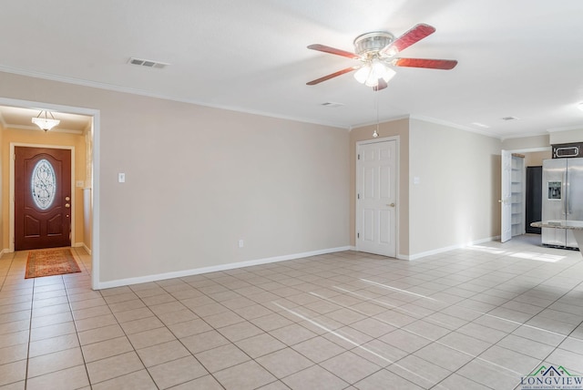 interior space with ornamental molding, ceiling fan, and light tile patterned floors