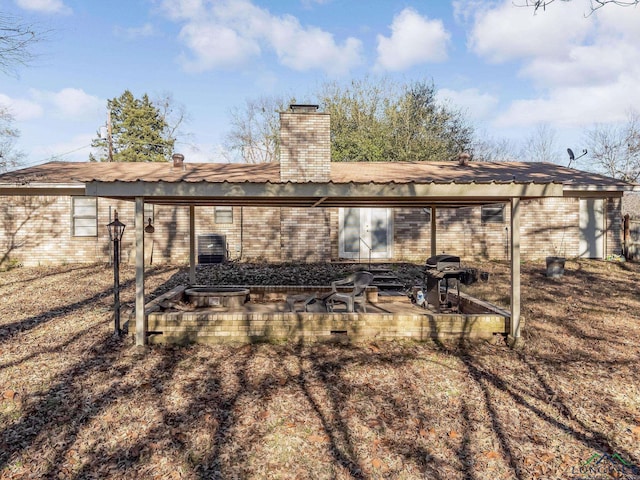 rear view of house with a patio