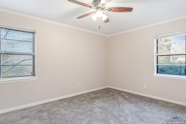 carpeted empty room with ornamental molding and ceiling fan