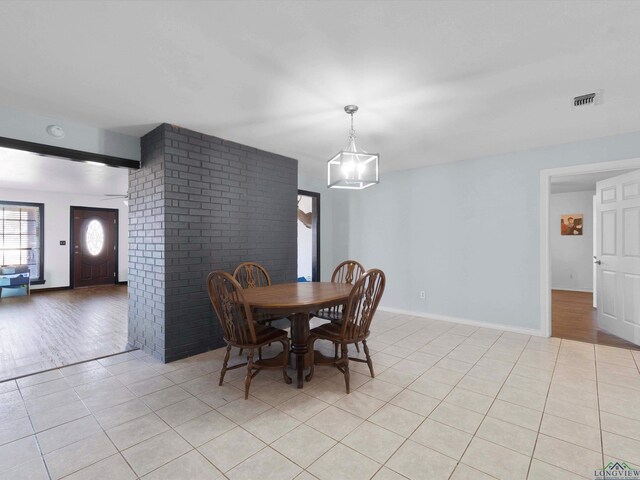 dining area with light tile patterned floors