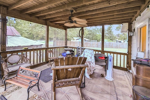 sunroom featuring beam ceiling and wood ceiling