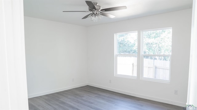 spare room featuring ceiling fan and hardwood / wood-style floors