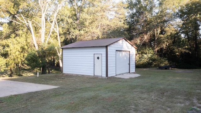 view of outbuilding featuring a yard