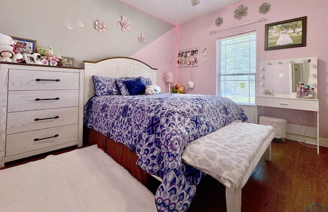 bedroom with lofted ceiling