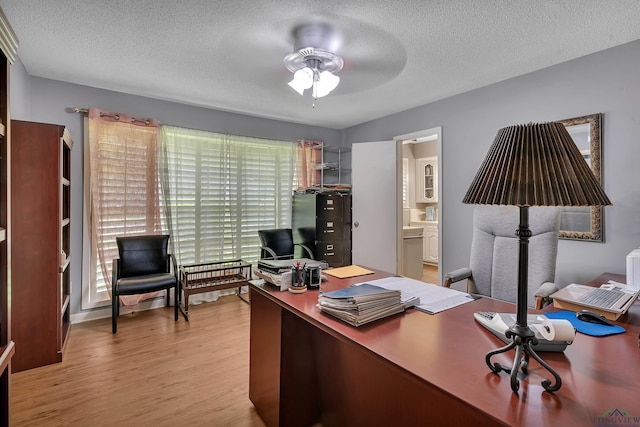 1303 Le Duke Blvd, Longview, TX 75601 - office area with wood finished floors, a textured ceiling, and a ceiling fan