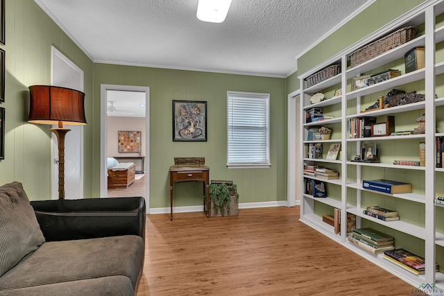 1303 Le Duke Blvd, Longview, TX 75601 - sitting room with crown molding, wood finished floors, and a textured ceiling