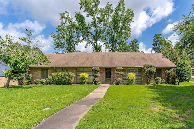 1303 Le Duke Blvd, Longview, TX 75601 - single story home featuring brick siding, a front lawn, and roof with shingles