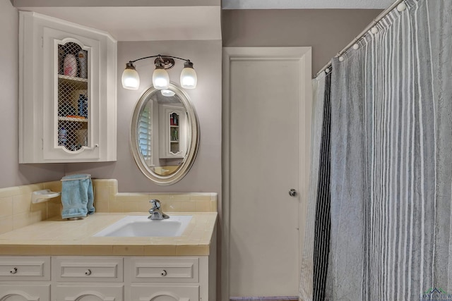1303 Le Duke Blvd, Longview, TX 75601 - bathroom with decorative backsplash and vanity