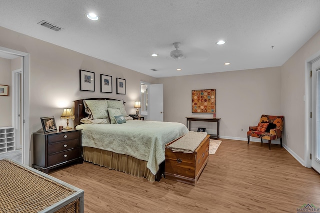 1303 Le Duke Blvd, Longview, TX 75601 - bedroom with light wood-type flooring, recessed lighting, a textured ceiling, and a ceiling fan