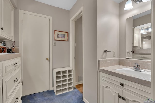 1303 Le Duke Blvd, Longview, TX 75601 - bathroom featuring backsplash and vanity