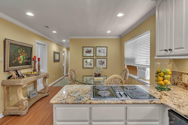 1303 Le Duke Blvd, Longview, TX 75601 - kitchen featuring stainless steel electric stovetop, light wood finished floors, ornamental molding, white cabinets, and recessed lighting