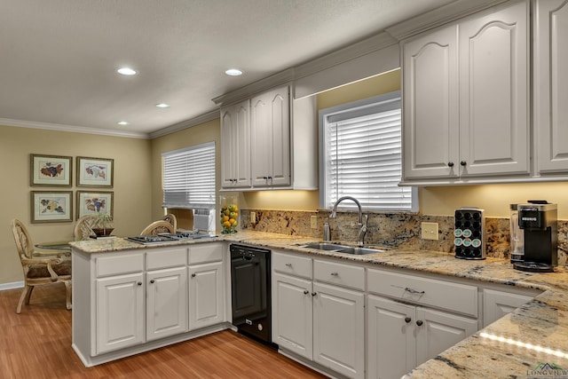 1303 Le Duke Blvd, Longview, TX 75601 - kitchen featuring dishwasher, a peninsula, crown molding, plenty of natural light, and light wood-type flooring
