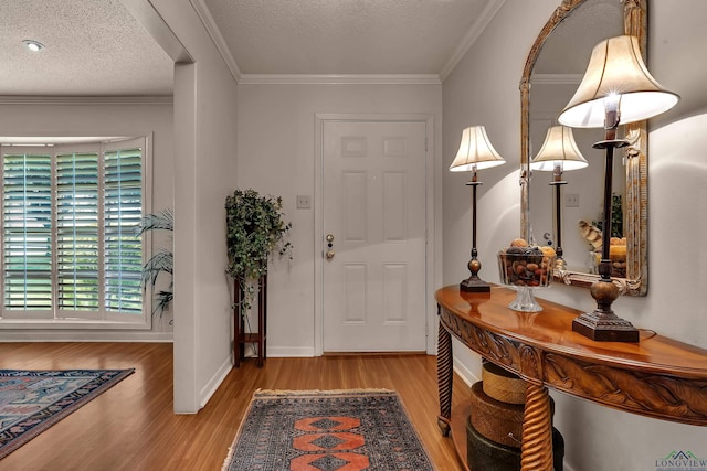 1303 Le Duke Blvd, Longview, TX 75601 - foyer with wood finished floors, a textured ceiling, and crown molding