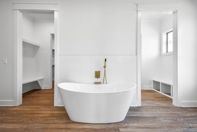 bathroom featuring hardwood / wood-style floors and a tub