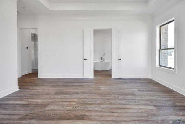spare room featuring dark wood-type flooring