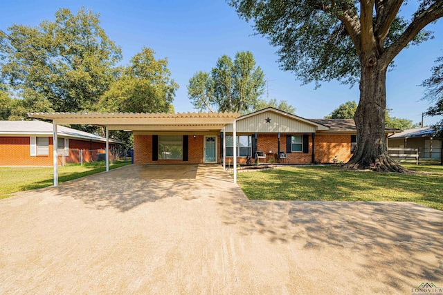 single story home with a carport and a front yard