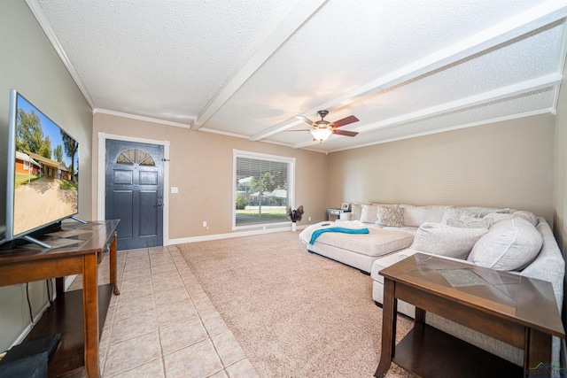 living room with ceiling fan, light tile patterned flooring, ornamental molding, and a textured ceiling