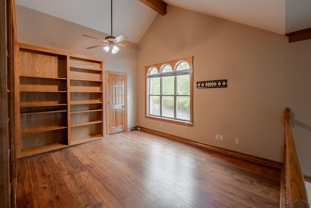 interior space with hardwood / wood-style floors, ceiling fan, beam ceiling, and high vaulted ceiling