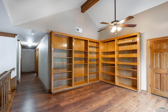 interior space featuring beamed ceiling, wood-type flooring, and high vaulted ceiling