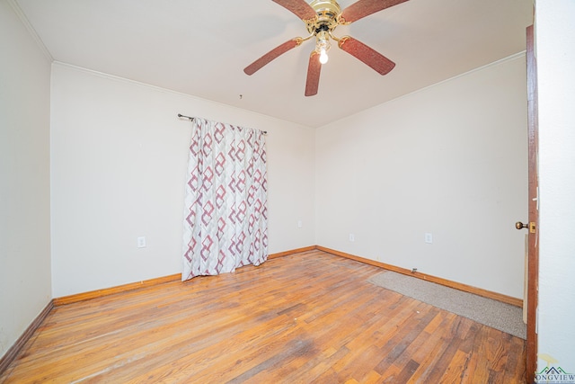 empty room featuring ceiling fan and light wood-type flooring