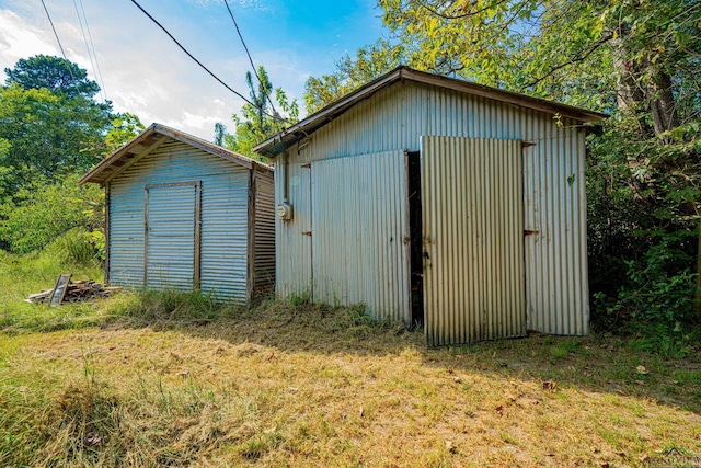 view of outbuilding with a lawn