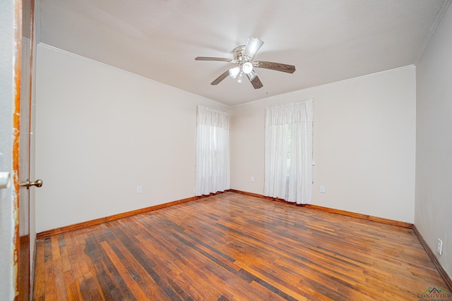 spare room with hardwood / wood-style floors, ceiling fan, and ornamental molding