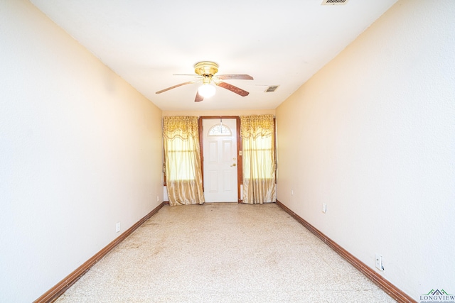 spare room with ceiling fan