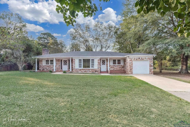 ranch-style home featuring a garage and a front lawn