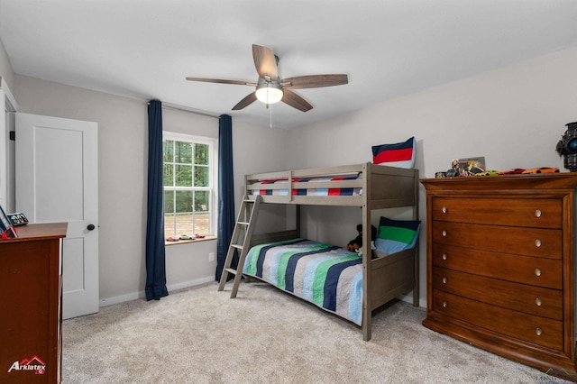 bedroom featuring ceiling fan, carpet floors, and baseboards
