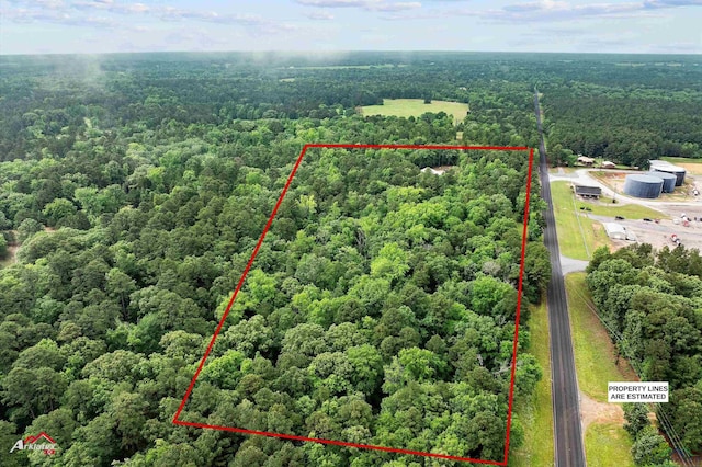 drone / aerial view featuring a view of trees