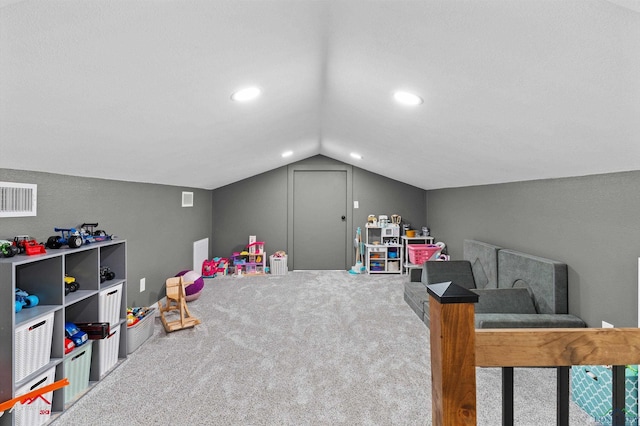 playroom featuring vaulted ceiling, carpet flooring, visible vents, and recessed lighting