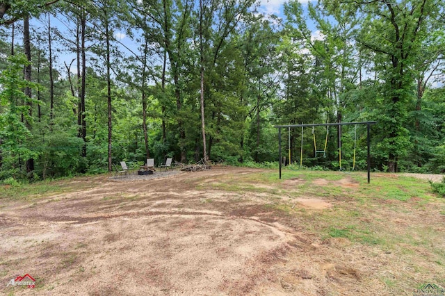view of yard with a view of trees