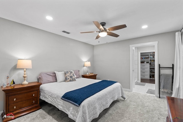 carpeted bedroom with baseboards, recessed lighting, visible vents, and a ceiling fan