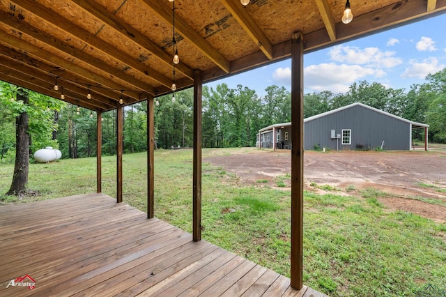 wooden terrace with a lawn