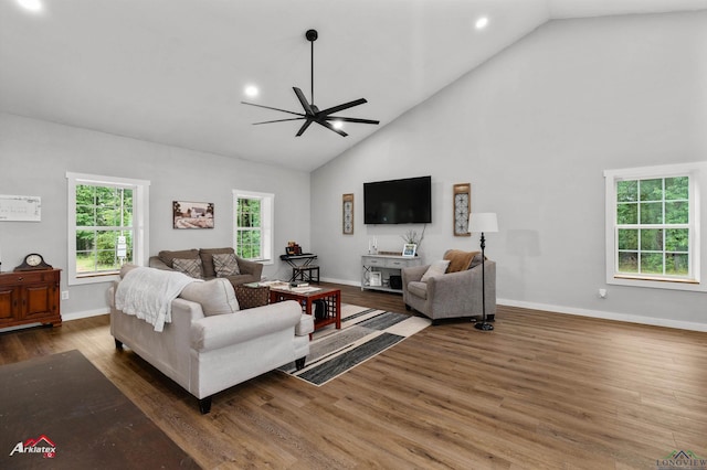 living room with wood finished floors, a ceiling fan, high vaulted ceiling, baseboards, and recessed lighting