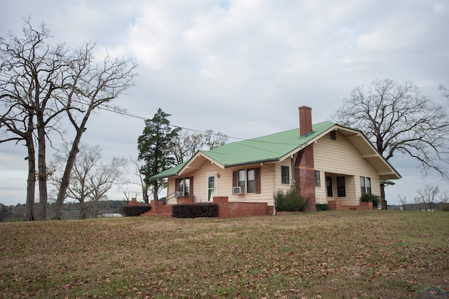 view of property exterior with cooling unit and a lawn