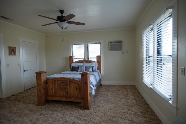 bedroom with ceiling fan, ornamental molding, carpet floors, and an AC wall unit