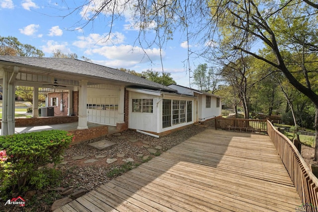 wooden deck with central air condition unit