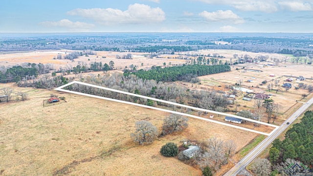 birds eye view of property featuring a rural view