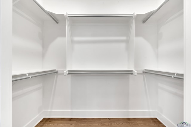 1513 Wellington Ln, Longview, TX 75605 - spacious closet featuring wood finished floors