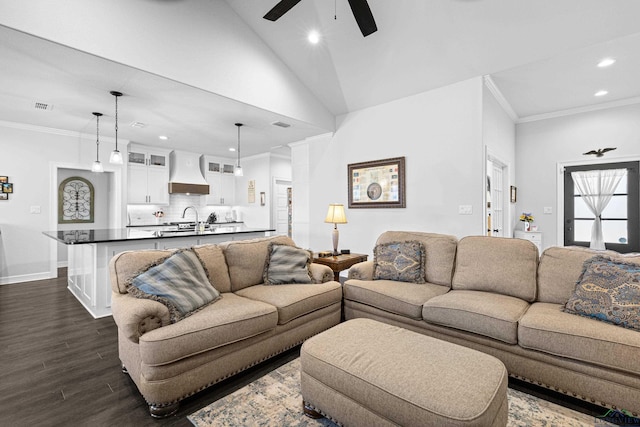 living room featuring crown molding, ceiling fan, dark wood-type flooring, and sink